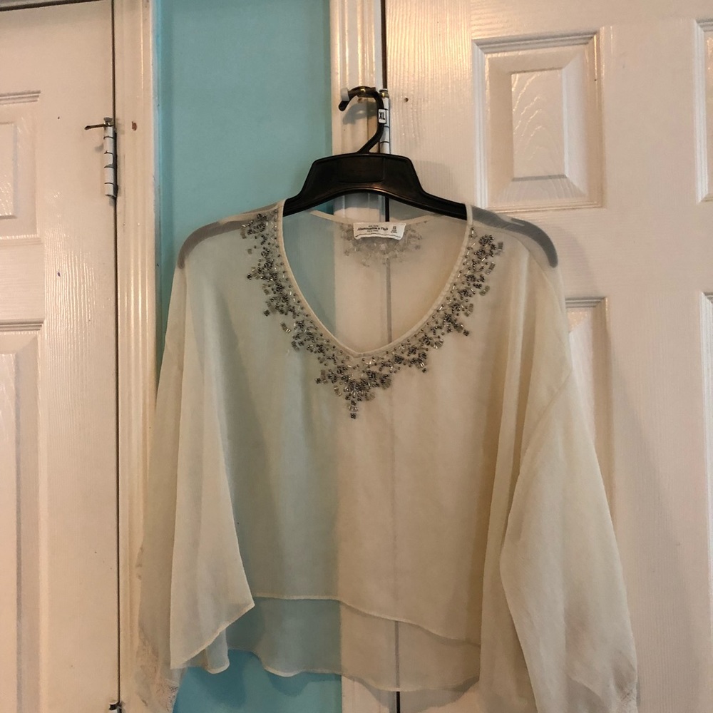 Sheer cream long sleeved top with detailing
